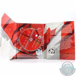 2005 Canada Uncirculated Dollar with Interactive CD-Rom (TAX Exempt). Capsule is lightly scratched, 