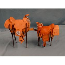 2 hand-crafted miniature saddles, 6" and 8" h