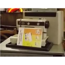 EATONS SEWING MACHINE WITH CASE