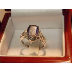 RING - OVAL FACETTED LOLITE WITH 4 DIAMONDS IN STERLING SILVER SETTING - ESTIMATE VALUE $425