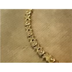 BRACELET - 5 GENUINE DIAMONDS IN STERLING SILVER SETTING - STERLING SILVER FASHIONED IN HUGS AND KIS