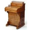 Image 1 : Art Nouveau carved oak Davenport with metal actioned rising stationery compartment and slide out wri