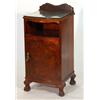 Image 1 : 1920s walnut bow fronted bedside cabinet with open shelf above a cupboard door on carved hairy paw f