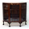 Image 1 : 1920s bow fronted walnut china cabinet, fitted a centre glazed door enclosing two shelves on carved 