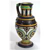 Image 1 : Continental pottery jug with mask handle and embossed band of stylised flowers and decorative panels