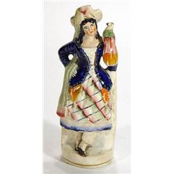 Hand painted Victorian Staffordshire figurine, a young maiden clutching a parrot, 22cm high