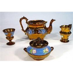 Victorian copper lustre pottery teapot, goblet, twin handled sugar bowl and cover and a jug, relief 