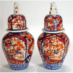 Pair of hand painted Japanese Imari porcelain vases and covers with Foo Dog knops, hand painted with