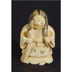 Ivory Netsuke of a grotesque gentleman with pop out eyes