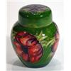 Image 1 : Moorcroft ginger jar and cover hand painted and tubelined with anemones onto a dark green ground, im