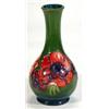 Image 1 : Moorcroft baluster vase hand painted and tubelined with anemones onto a dark green ground, impressed