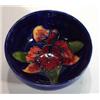 Image 1 : Small Moorcroft bowl hand painted and tubelined with orchids onto a blue ground, impressed marks to 