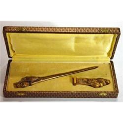 Cased bronze bird design letter opener and seal marked Leroy to blade