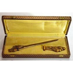 Cased bronze bird design letter opener and seal marked Leroy to blade