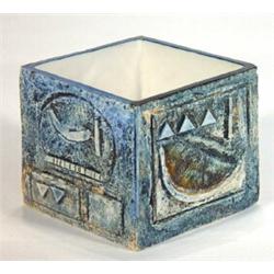 Square based Troika pottery vase decorated with an incised abstract pattern onto a blue and green gr