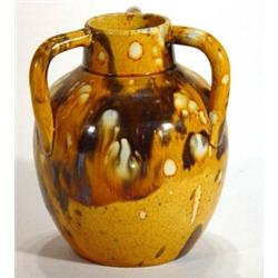 Dunmore pottery three handled vase with a brown and yellow mottled glaze, impressed marks to base, 1