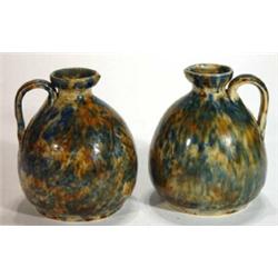 Pair of blue, green and brown mottle glazed Gibson Canning pottery ewers, impressed marks to base, 1