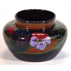 Gouda pottery squat vase hand painted with a band of Art Nouveau style flowers, marks to base, 12cm 