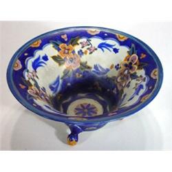 Carltonware three footed bowl hand painted with flowers onto a blue ground, marks to base, 26cm diam