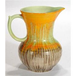 Shelley dripping glazed jug, decorated in oranges, greens and browns, marks to base, 21cm high