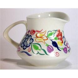 Poole Pottery traditional jug, hand painted with a band of flowers, marks to base, 11cm high