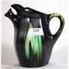 Image 1 : Black and green glazed Continental pottery jug with spout, marks to base, 20cm high