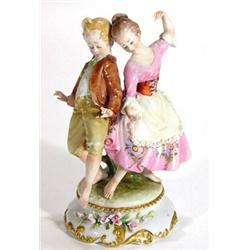 Continental porcelain figure group, two hand painted dancing children on circular base, blue undergl