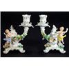 Pair of hand painted Continental porcelain cherub design candlesticks relief moulded with flowers, b