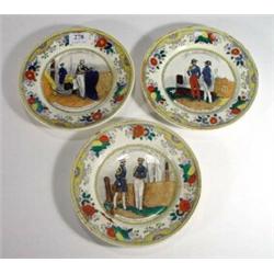 Three French Victorian pottery plates hand coloured and transfer printed with scenes of military cos