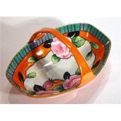 Noritake porcelain basket hand painted with roses onto an orange and green ground, marks to base, 19