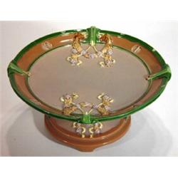 Eichwald Art Nouveau pottery tazza decorated with swags of flowers onto a green and brown ground, im