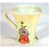 Image 1 : Radford pottery jug hand painted with flowers onto a mottled yellow ground, marks to base, 12cm high