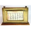 Image 1 : Brass and oak desk calendar, 24cm in length