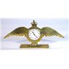 Image 1 : Brass RAF wing design clock with eight day movement, 30cm in length