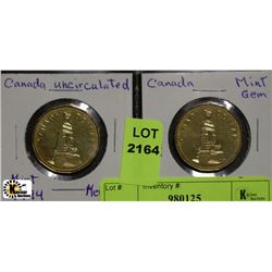 A) 2 MINT 1994 MEMORIAL MINT DOLLARS