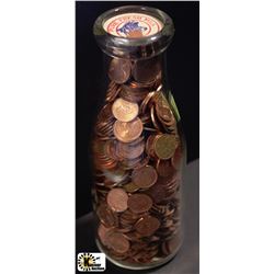 PALM DAIRIES MILK BOTTLE W/ COLLECTION OF PENNIES