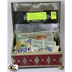ESTATE TIN WITH STAMPS, COINS AND TRINKETS