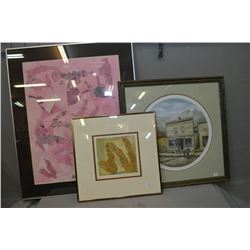 Three framed prints including Joan Healey  The Drugstore  two Oksana prints including a 1/1 artist p