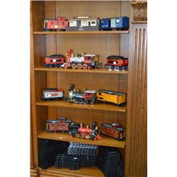 Shelf lots of collectible electric trains with track and station