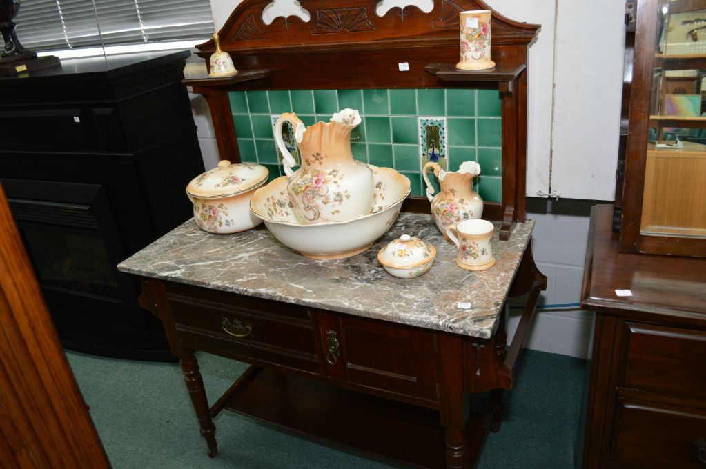 Antique English washstand with marble top and tile back