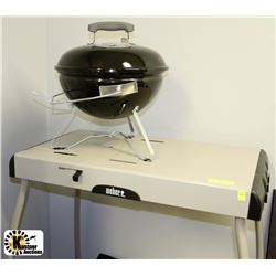 NEW WEBER BARBEQUE ON TABLE