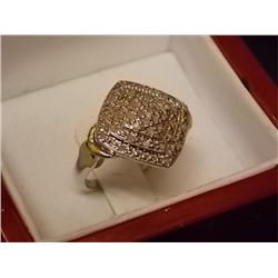 RING - 35 (0.40 CTW) FACETTED DIAMONDS SET IN A CLASSIC DESIGN OF STERLING SILVER - GOLD FINISH "X" 