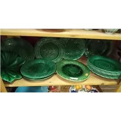 SHELF LOT OF POTTERY GREEN PLATES