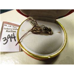 Ladies 10K Gold Ring with a .10 carat Genuine Diamond in a Japanese silk covered box.