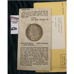 1884 O Superb Gem BU Morgan Silver Dollar in original "Tidy House Products Co." Advertising holder w