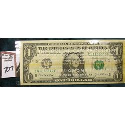 Series 2003A One Dollar Federal Reserve Note in a clear advertising wrapper stating "This Dollar Can