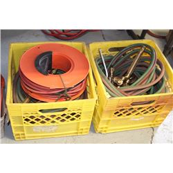 TWO MILK CRATES WITH OXY-ACETELYNE HOSES & TORCHES