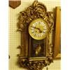 Image 1 : Gilt decorative wall clock with brass face an…