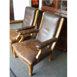 Pair of late Victorian oak open arm leather l…