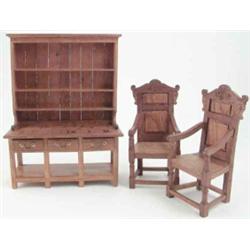 A miniature oak dresser, together with a pair of miniature oak arm chairs of 17th century design,...